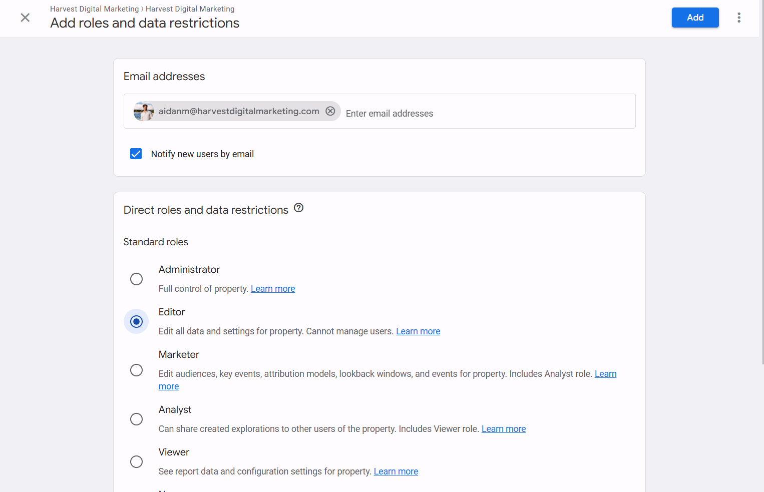 The Add roles screen in Google Analytics with an email entered, the Editor role selected, and the Add button in the top right